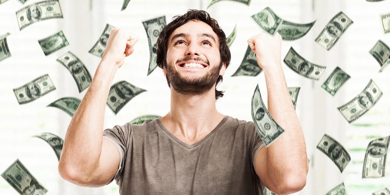 A happy man with cash raining in background