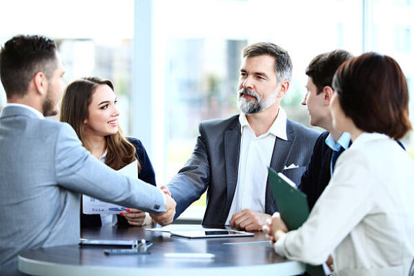 A business meeting People making deal during a business meeting