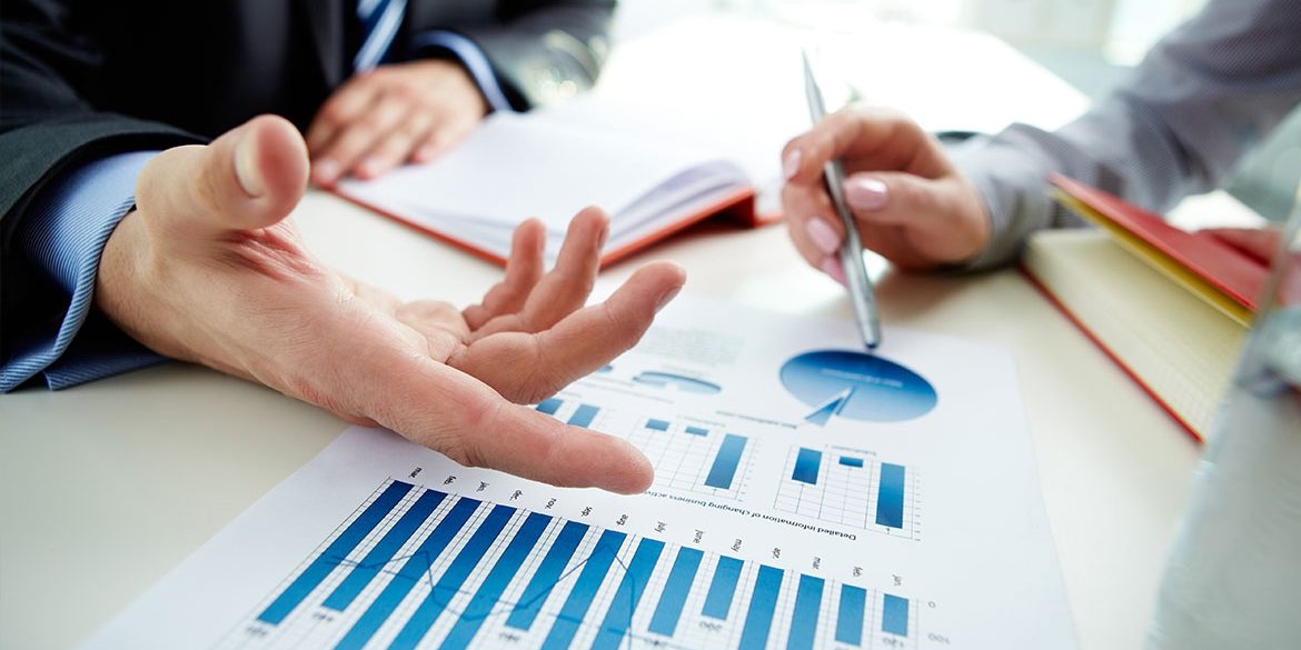 Business people working on report Business people working on a business report