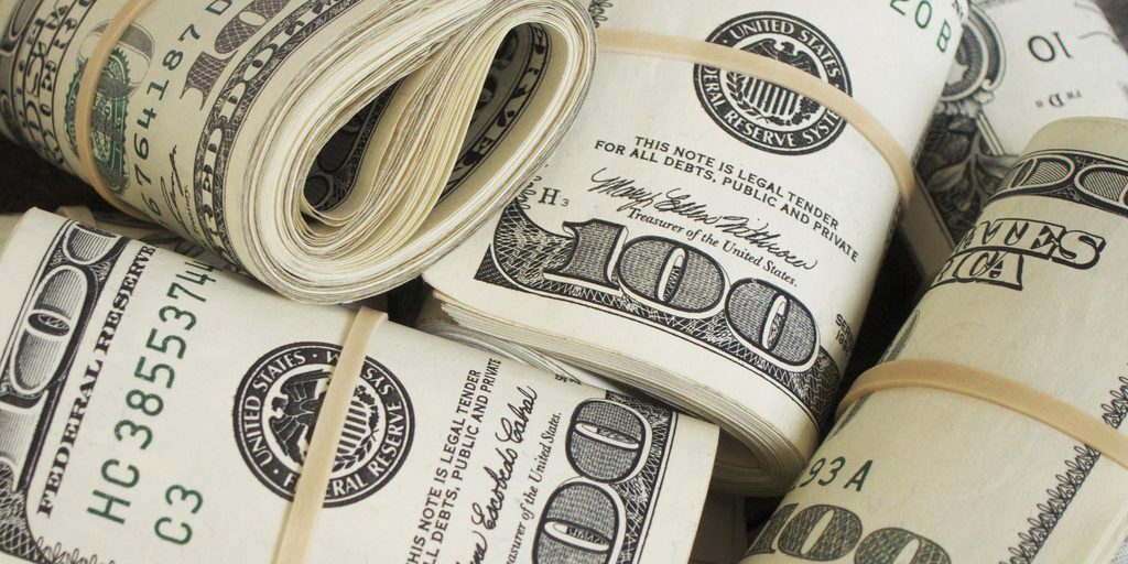 Folded piles of cash