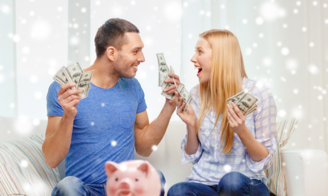 A happy couple holding cash A happy couple holding cash in both hands