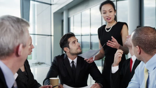 Four colleagues during a meeting Four colleagues during a business meeting