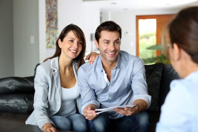 Two happy clients meeting a consultant Two happy clients meeting a consultant from Strategic Capital