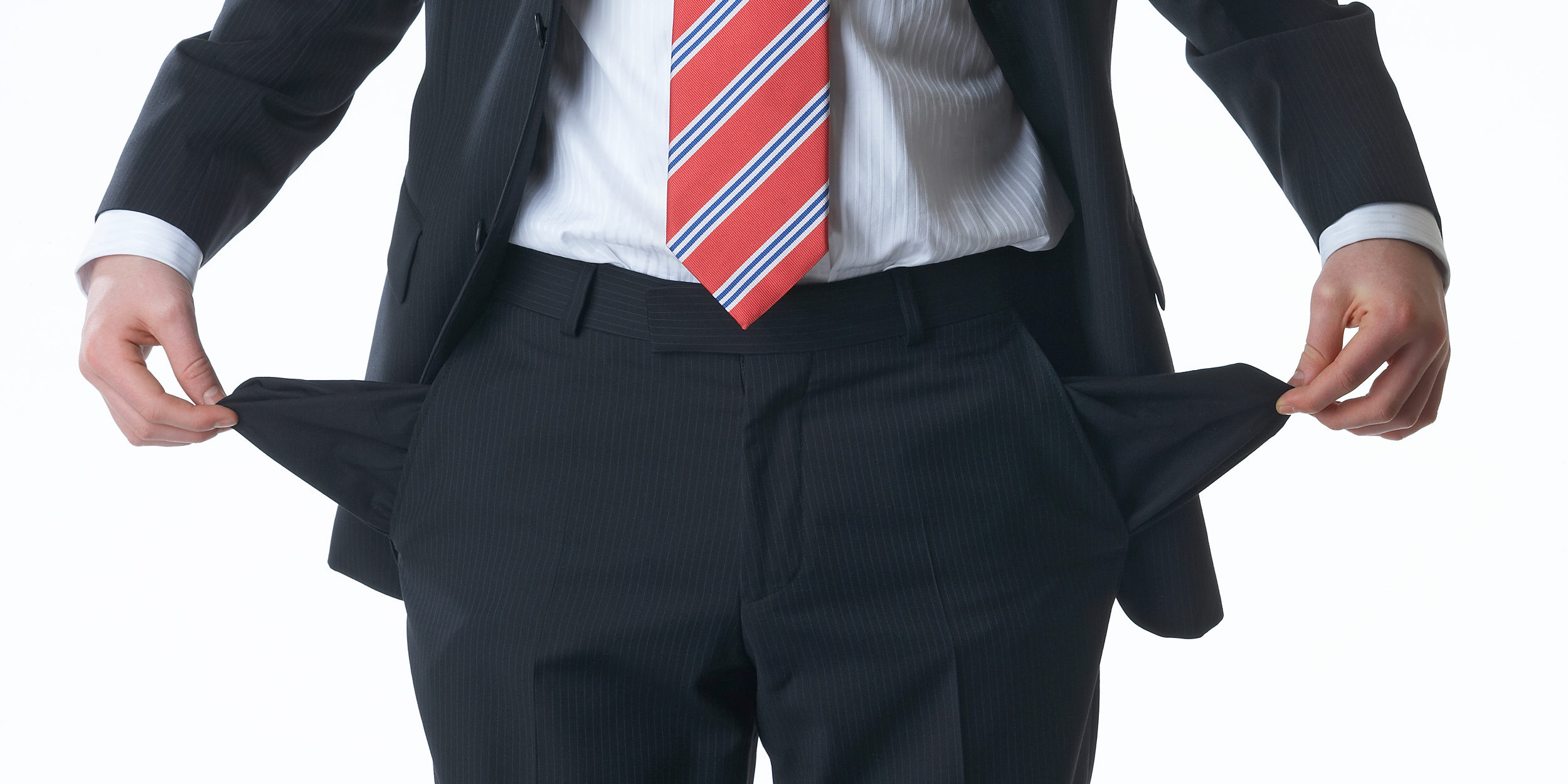 A man showing his empty pockets A man showing his empty pockets