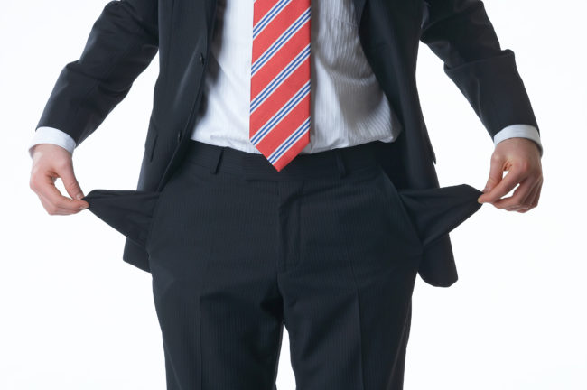 A man showing his empty pockets