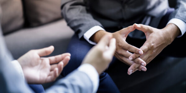 Hands of clients during discussion Two pairs of hands of clients busy in discussion