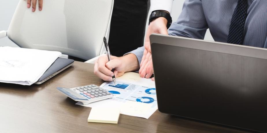 Two people busy in making a business report