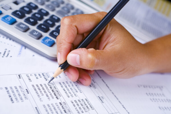 Hand checking financial report Hand checking financial report